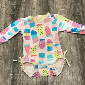 Rufflebutts Long Sleeve One Piece Rash Guard in Ice Cream social 3-6 months